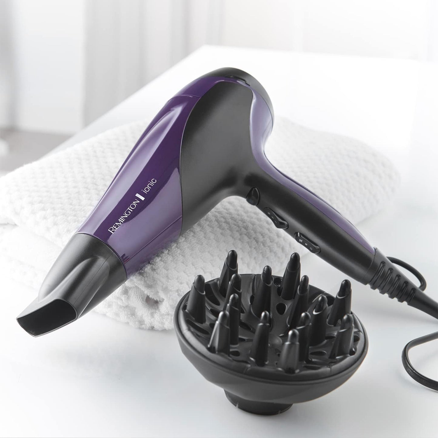 Next Day Delivery RRP £51.99Remington Hair Dryer Ionic (Powerful, Fast Professional Styling, Diffuser, Concentrator, Ionic Conditioning for Frizz Free Hair, 3 Heat / 2 Speed Settings, Cool Shot, 2200W, Purple) D3190