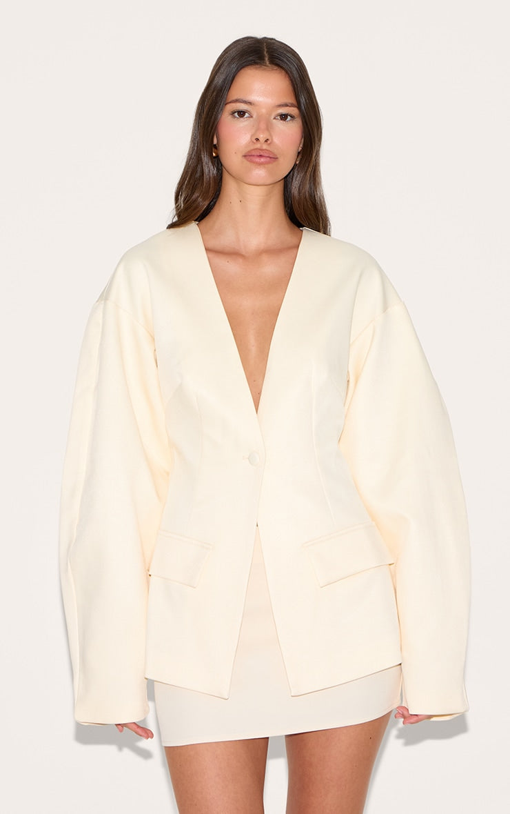 https://cdn-img.prettylittlething.com/6/5/d/a/65da05506ca7a2b9eb36c11c72bcc02cf9a3f72b_CNM1409_1_ecru_cocoon_sleeve_cinched_waist_pocket_blazer.jpg