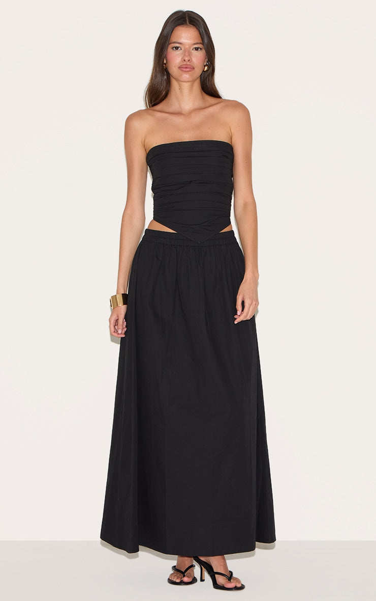 https://cdn-img.prettylittlething.com/7/3/d/a/73dab0deb7582a45fbb9862191dbe18b0a513b3c_CNM3953_1_black_cotton_poplin_a_line_low_rise_maxi_skirt.jpg