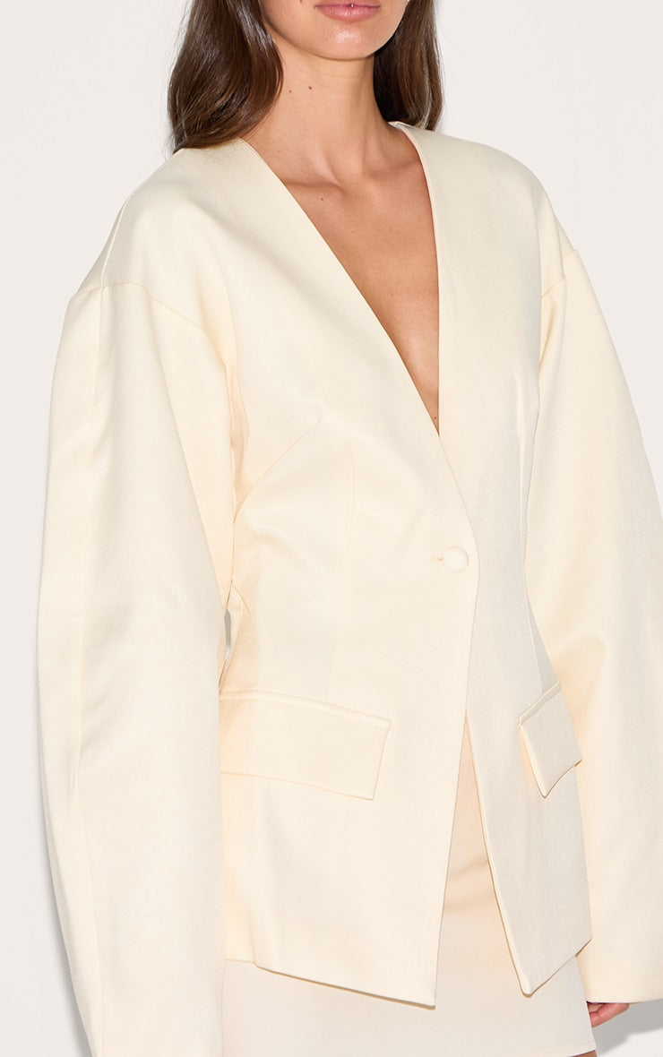 https://cdn-img.prettylittlething.com/7/8/4/9/78494aaad612fd0f9de2ea6926ce6cad3c7ca7fe_CNM1409_4_ecru_cocoon_sleeve_cinched_waist_pocket_blazer.jpg