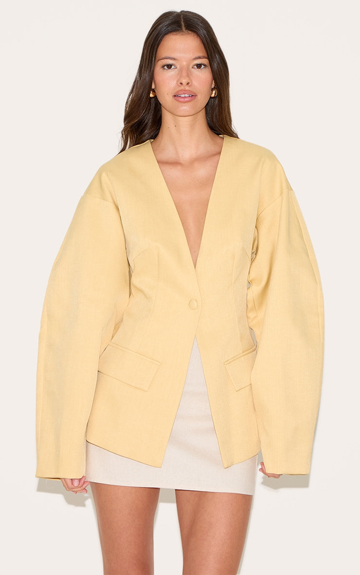 https://cdn-img.prettylittlething.com/7/b/5/3/7b53292d24f94258f4cc24e1d14265d89c89802e_CNM1408_1_butter_yellow_cocoon_sleeve_cinched_waist_pocket_blazer.jpg