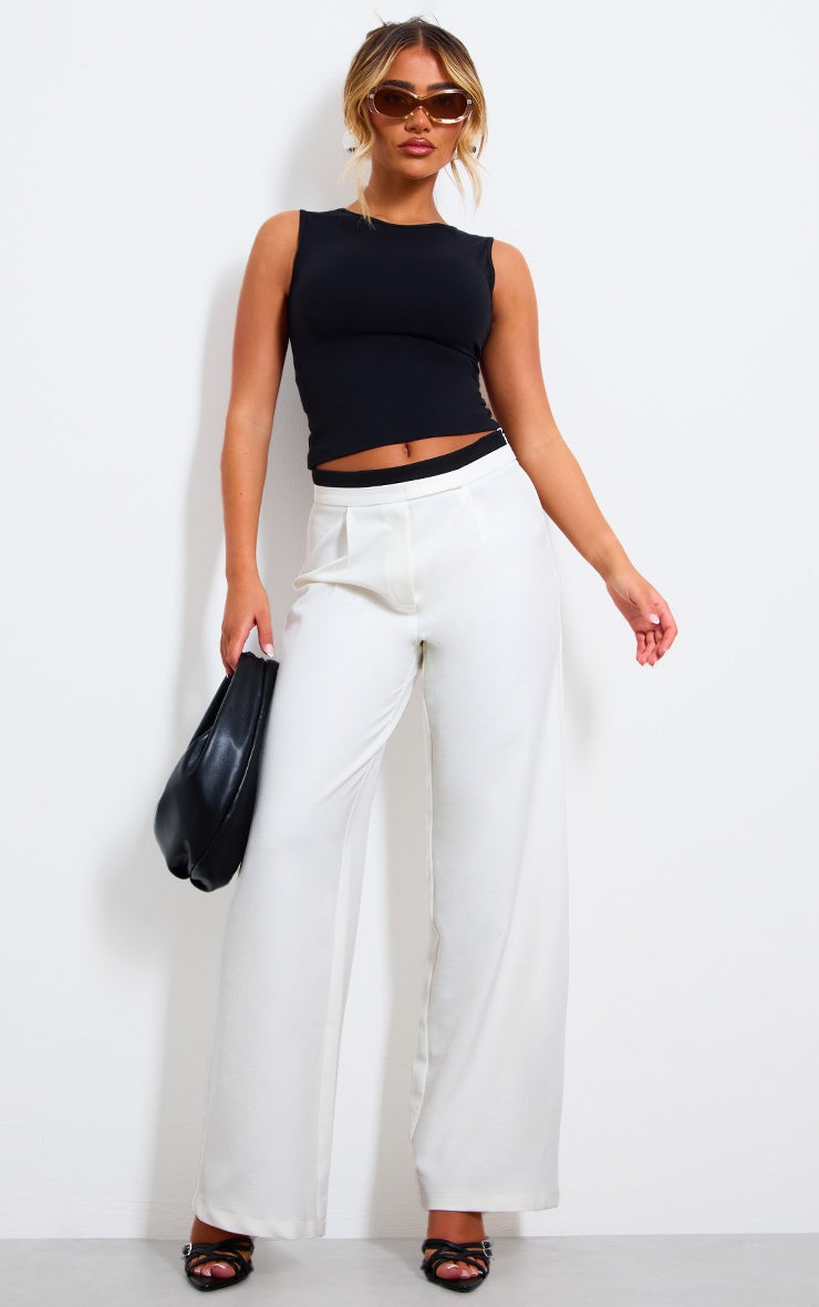 https://cdn-img.prettylittlething.com/a/6/5/e/a65eb7f61a904bb74e13bb273b6cf6daac7a90e3_CNK1254_3_black_contour_crew_neck_fitted_vest_top.jpg