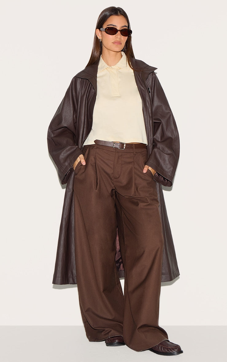 https://cdn-img.prettylittlething.com/a/b/4/8/ab487fc67c338c9c037d97544f6a19a4a5341433_CNL6854_1_brown_funnel_neck_faux_leather_trench_coat.jpg