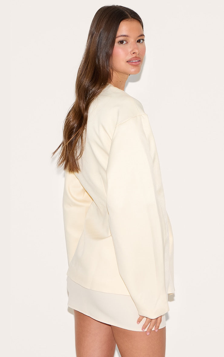https://cdn-img.prettylittlething.com/a/c/3/9/ac39035e26a0db887a1c67360e7729197a22e465_CNM1409_2_ecru_cocoon_sleeve_cinched_waist_pocket_blazer.jpg