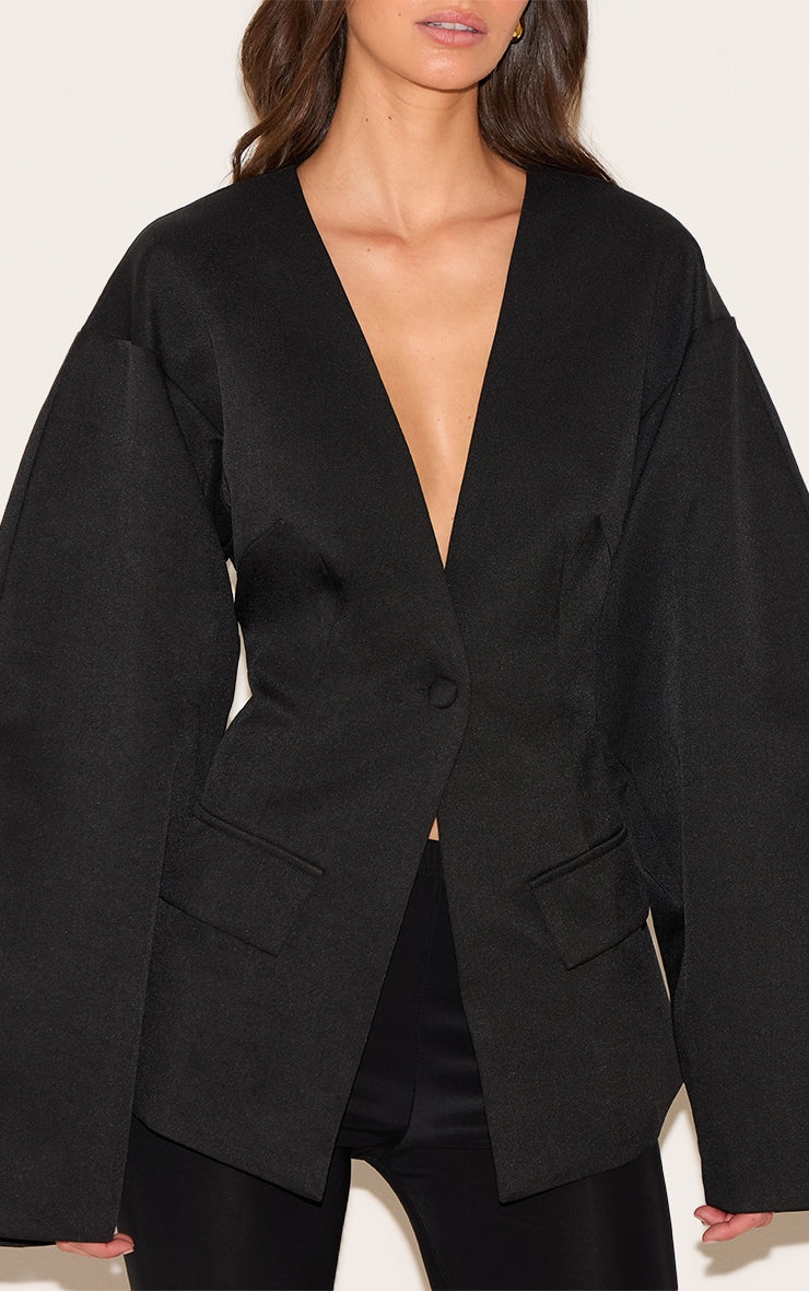 https://cdn-img.prettylittlething.com/b/8/2/9/b829eb7fefa1cc7cc2f6155f0bc04b7303915f39_cnm1407_4_black_cocoon_sleeve_cinched_waist_pocket_blazer.jpg