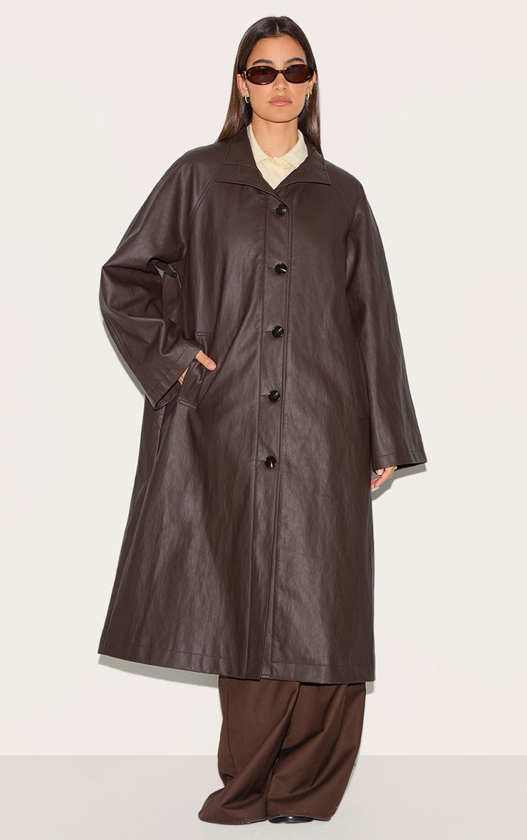 https://cdn-img.prettylittlething.com/b/c/7/5/bc75af3dbeaafdf65d92847e3f233a769af9c9f3_CNL6854_3_brown_funnel_neck_faux_leather_trench_coat.jpg