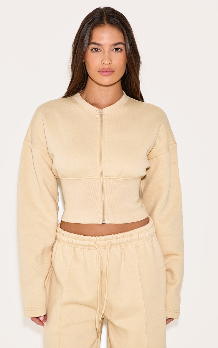 https://cdn-img.prettylittlething.com/d/e/e/8/dee89bd584b41b10722e83605f8d20be9d3a673e_CNL8027_1_latte_extreme_cinched_waist_sweatshirt.jpg