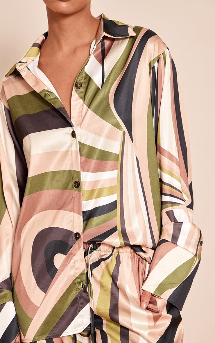 https://cdn-img.prettylittlething.com/f/8/a/3/f8a3a186c4713d836271b209c237b4991beb794e_CNO0033_4_green_abstract_print_oversized_deep_cuff_shirt.jpg
