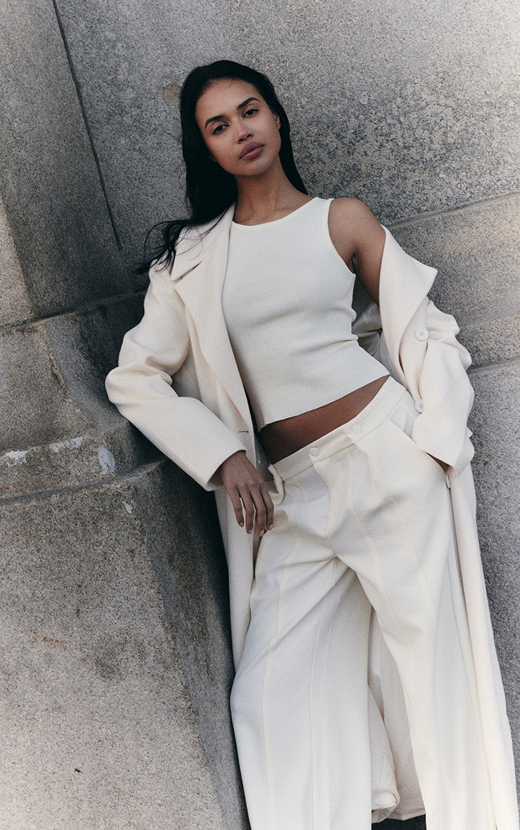 https://cdn-img.prettylittlething.com/4/a/6/c/4a6cbf43eb48a52eab0a7a7fdebc87bcfdebc7e3_CNL6071_4_cream_fine_knit_racer_neck_top.jpg