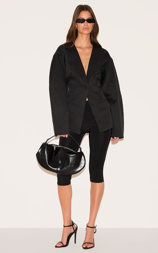 https://cdn-img.prettylittlething.com/9/c/d/8/9cd80708a20d48ce10eb534e3a96491f5277eb4a_cnm1407_1_black_cocoon_sleeve_cinched_waist_pocket_blazer.jpg
