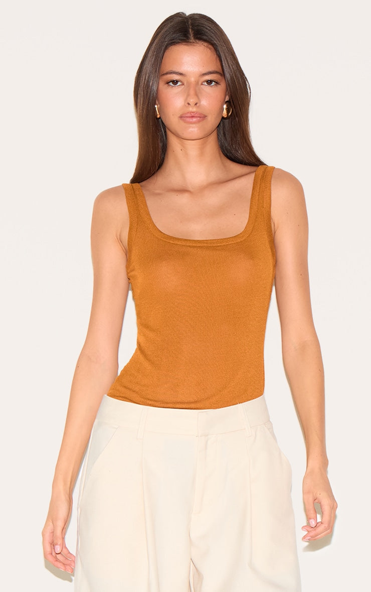 https://cdn-img.prettylittlething.com/a/1/8/6/a18610e4212b3e243722b11f83248ff1b2974a39_CNM3752_1_tan_sheer_soft_touch_scoop_neck_long_vest_top.jpg