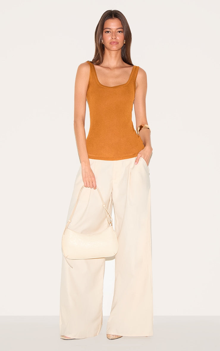 https://cdn-img.prettylittlething.com/c/4/2/8/c4282cd10f3be37a70f380b6850f612a44f3faa7_CNM3752_3_tan_sheer_soft_touch_scoop_neck_long_vest_top.jpg