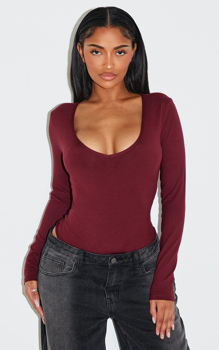 https://cdn-img.prettylittlething.com/d/c/0/2/dc026d94a6718c2638903a1a586d88c389e18fbb_CNL9496_1_shape_burgundy_sculpted_v_neck_long_sleeve_bodysuit.jpg