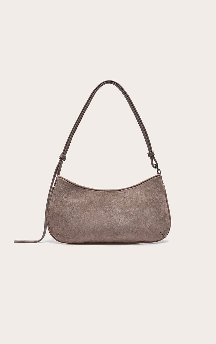 https://cdn-img.prettylittlething.com/e/5/0/b/e50b10f896a3efe578228daa161ccc653a6fc258_CNL7998_3_taupe_faux_suede_baguette_shoulder_bag.jpg