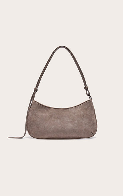 https://cdn-img.prettylittlething.com/e/5/0/b/e50b10f896a3efe578228daa161ccc653a6fc258_CNL7998_3_taupe_faux_suede_baguette_shoulder_bag.jpg