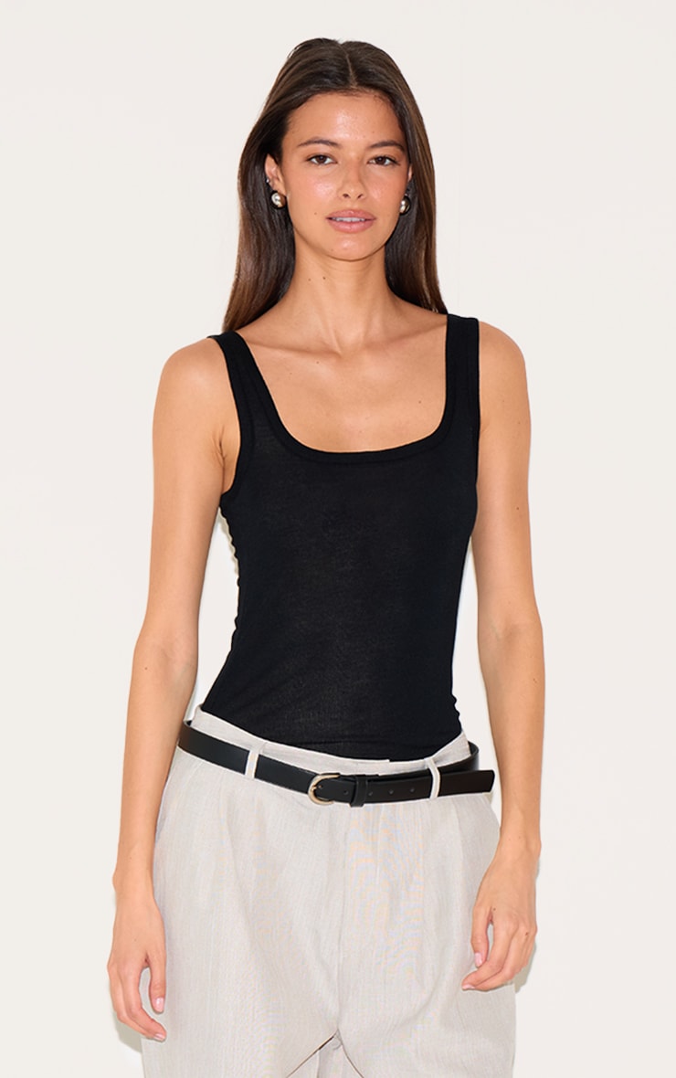 https://cdn-img.prettylittlething.com/e/c/c/a/eccade15418b6ad6bea4ebddfc73287715d20fee_CNM3750_1_black_sheer_soft_touch_scoop_neck_long_vest_top.jpg