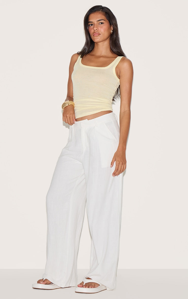 https://cdn-img.prettylittlething.com/f/4/1/c/f41c002b3b778bb8328475711f08f5d39afbda5d_CNM6307_3_lemon_sheer_soft_touch_scoop_neck_long_vest_top.jpg