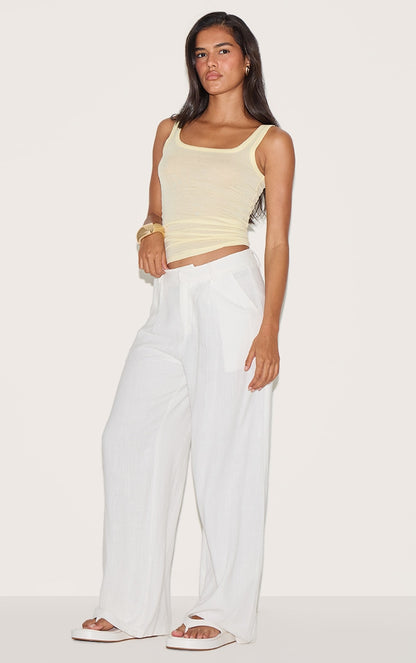 https://cdn-img.prettylittlething.com/f/4/1/c/f41c002b3b778bb8328475711f08f5d39afbda5d_CNM6307_3_lemon_sheer_soft_touch_scoop_neck_long_vest_top.jpg