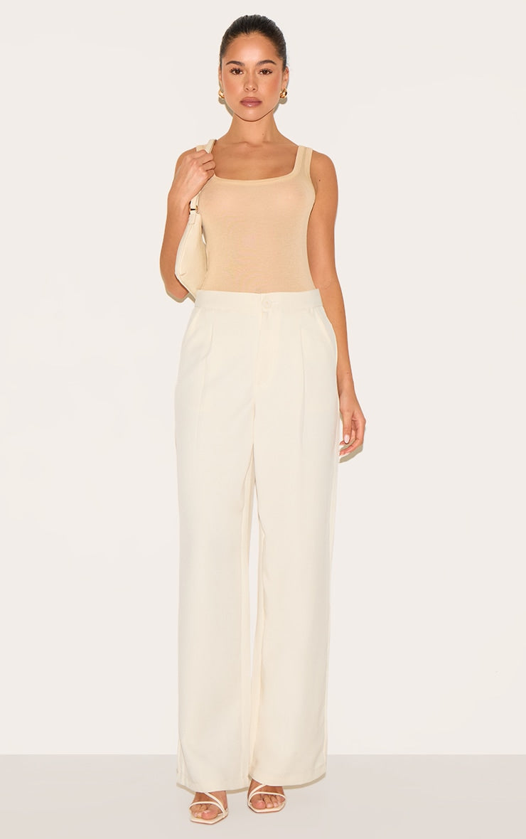 https://cdn-img.prettylittlething.com/f/9/6/3/f9631986ae01939681baa61cde3078291f5f504b_CNM6308_3_beige_sheer_soft_touch_scoop_neck_long_vest_top.jpg