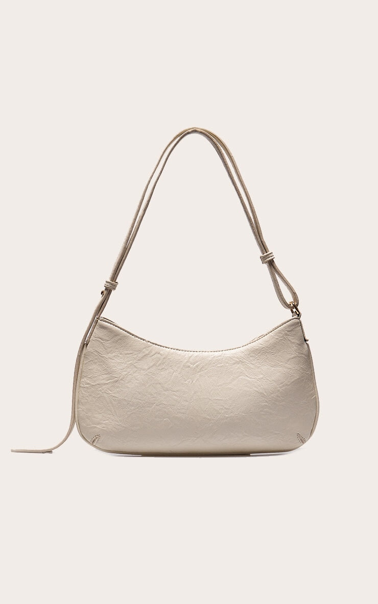 https://cdn-img.prettylittlething.com/f/b/1/7/fb17ef1b3c2293b09288e8448fbbb37bf51dfabf_CNL7999_3_cream_textured_pu_baguette_shoulder_bag.jpg
